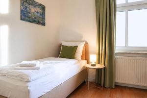 Ruhiges & modernes 5-Personen Apartment mit Boxspringbetten, Smart-TV, Wlan und Balkon