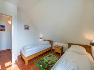 Feriendorf Rugana - Komfortplus Ferienwohnung mit 2 Schlafzimmern und Terrasse A64