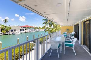 Waterfront duplex with hot tub, pool, & beach access - WD, balcony, and grill