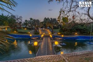StayVistas Kaimalgarh Aravalli Estate - Outdoor Pool, Lake View & Orchard