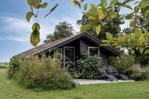 House By Forest And Roskilde Fjords Waves