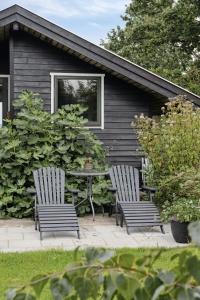 House By Forest And Roskilde Fjords Waves