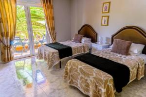 Villa Camaleão with Waterfall Pool by LovelyStay