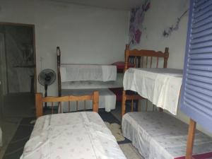 Pousada Dádiva 4 Quarto compartilhado Feminino Econômico e Simples Praia do Pontal Centro