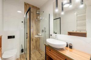 Cozy Apartment Near the Beach with Parking and Balcony in Pogorzelica by Noclegi Renters