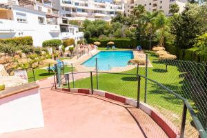 Bright Coastal Apartment with Pool and Parking