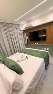 Flat 50m da praia com Piscina, academia, Até 3 pessoas