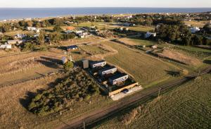 Dread Shack Nodo Norte 1 - Casa en Complejo Zona Santa Isabel, Chapa Para 4 PAX Con Parrilla - Hola Sur