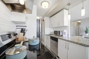 Stylish 2BR condo with 2 Balconies & Workspace
