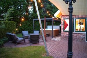 De Brittenburg 4-persoons, finse sauna, hottub, sunshower, grote zonnige omheinde tuin, wifi en huisdier vriendelijk