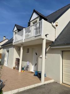 Maison avec balcon