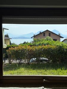 Appartamento BELLAVISTA con VISTA LAGO e GIARDINO privato
