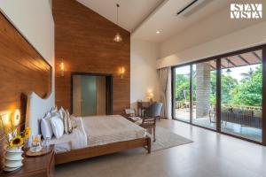 StayVista at Villa Rouge with Pool & Lawn