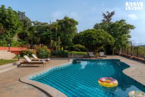 StayVista at Villa Rouge with Pool & Lawn