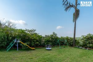 StayVista at Villa Rouge with Pool & Lawn