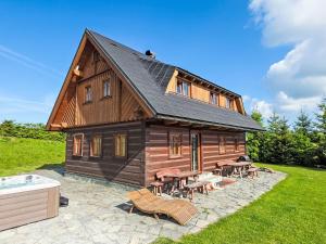 Chalet Timber Lodge with Hydromassage by Interhome
