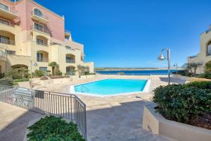 Beachfront Apt with Pool Access