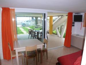 Seafront flat with covered patio