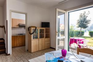 Nice house with garden and pool in Bibione