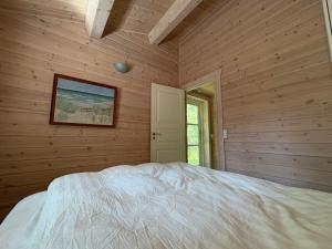 Traditional Log House Near Beach And Forest