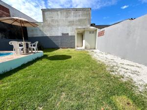 CASA COM PISCINA PARA TEMPORADA EM GUARATUBA Pr