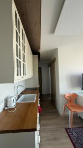 Apartamentai prie baseino