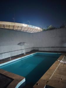 Espaço LD quarto com piscina