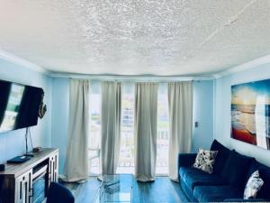 Sandy Seawall Escape Resort