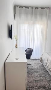 Quarto com casa de banho privativo