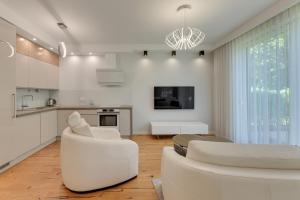 Tre Mare z ogrodem 2 by Grand Apartments