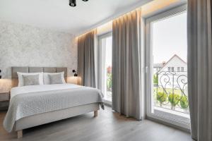 Slow Łeba Bałtycka - Klimatyzowane apartamenty z aneksami kuchennymi