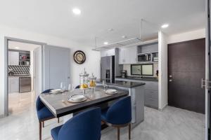 Hotel suite with ocean-view rooftop infinity pool, balconies & AC