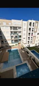 Appartement avec piscine, balcon clim parking