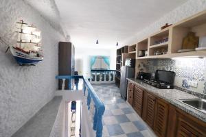 Prachtig strandhuis met directe toegang tot het felbegeerde Playa Blanca strand met 3 badkamers, 2 grote livings en adembenemend terras