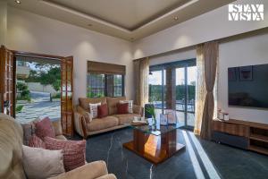 StayVistas Solmira Haven - 4BHK Villa with Infinity Pool & Sports Turf
