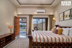 StayVistas Solmira Haven - 4BHK Villa with Infinity Pool & Sports Turf