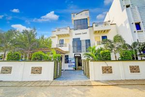 Hotel O by OYO The Happy Land Hotel & Cafe
