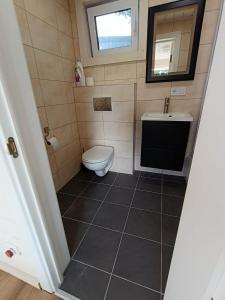 Tiny house aan het water op de appelhof