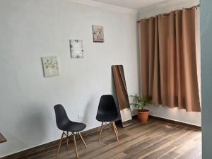 Room in a residential complex across from the airport