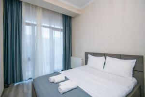 Cozy Saburtalo Stay with Balcony View