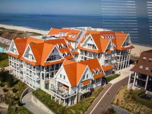 Familie beachhuis op de duinen (Duinhuis)