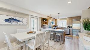 Luxurious oceanfront townhome with private deck and panoramic coastal views