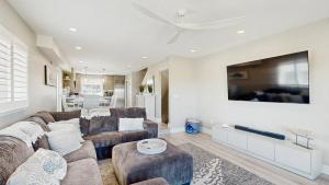 Luxurious oceanfront townhome with private deck and panoramic coastal views