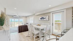 Luxurious oceanfront townhome with private deck and panoramic coastal views