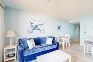 Captivating beachfront condo with balcony views pools gym & tennis court