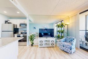 Captivating beachfront condo with balcony views pools gym & tennis court