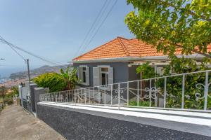 Above Funchal · A Hillside Home