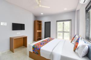 FabHotel Ojas Inn