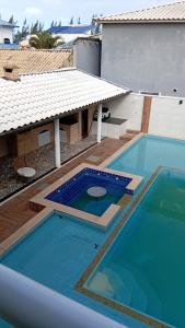 Casa pé na área com hidromassagem e piscina