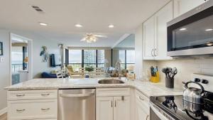 Sunny coastal condo with beach views balcony pools gym sauna & AC
